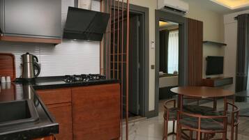 Family Apartment, Balcony, Pool View | Private kitchen | Full-size fridge, microwave, stovetop, dishwasher