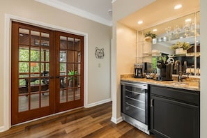 A kitchen with a built-in oven, a coffee maker, and a sink. - Newly renovated Chetola 2BR/2BA · Resort amenities (Blowing Rock)