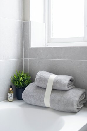 Shower, hair dryer, towels, soap