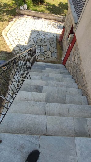 A stone staircase leading to a building entrance.