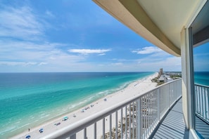 A balcony with a view of a beach and ocean. - 🐚Gulf Front Views | Balcony | Pool | Palazzo 908🌴 (Panama City Beach)