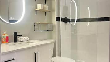 Shower, hair dryer, towels, shampoo