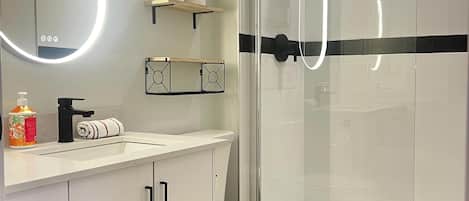 Shower, hair dryer, towels, shampoo