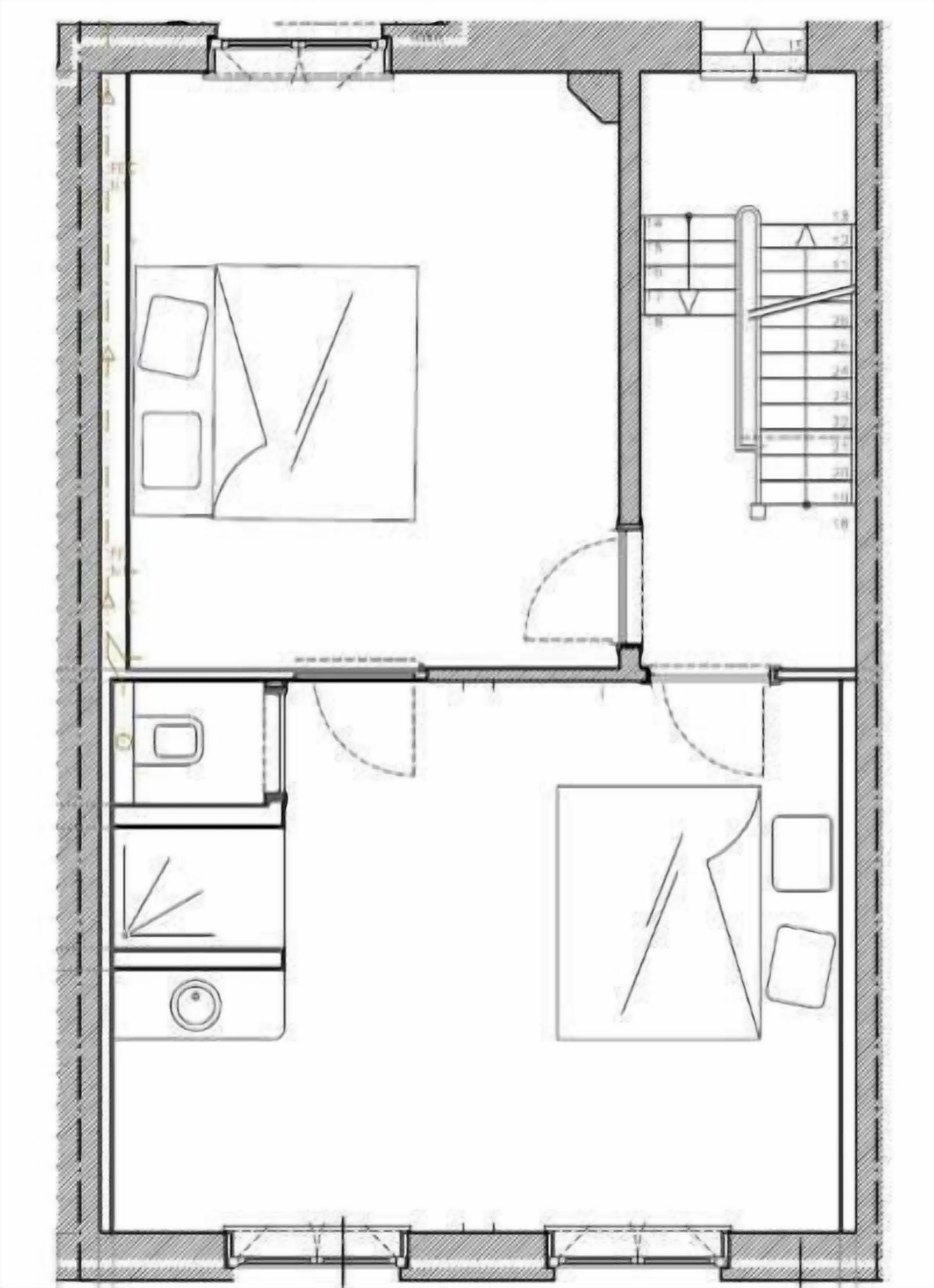 Een plattegrond met een badkamer, keuken, eethoek en woonkamer.