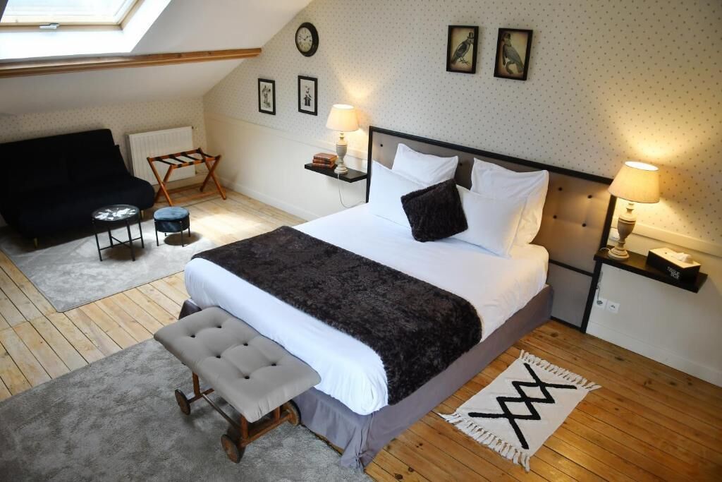 Chambre Triple Deluxe, vue jardin | Fer et planche à repasser, Wi-Fi gratuit