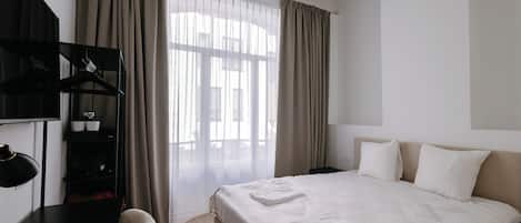 Double Room, City View | Iron/ironing board, free WiFi, bed sheets