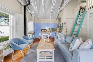 A modern interior with a dining area, kitchen, and living space.
