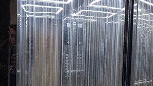 A modern elevator with reflective glass walls and geometric light fixtures. - 2-bedroom apartment in adorable Tangier with AC comfort (Tangier)