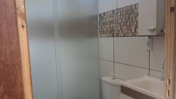 Shower, towels, soap, toilet paper