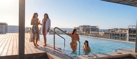 2 outdoor pools, open 7:00 AM to 11:00 PM, pool loungers