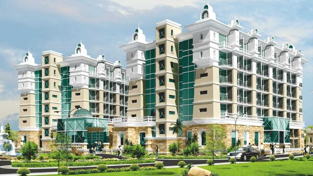 A multi-story hotel with a central courtyard, stone facade, and a dome structure. - Saramax Inn (Roorkee)