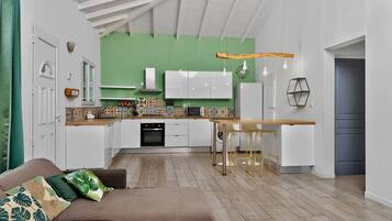 Family Villa, Balcony | Living area | 55-inch LED TV with cable channels