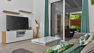 Family Villa, Balcony | Living area | 55-inch LED TV with cable channels