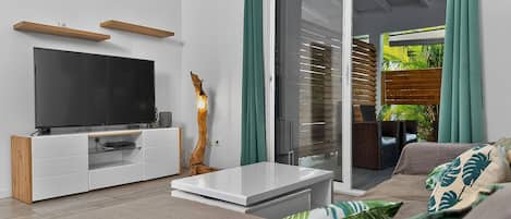 Family Villa, Balcony | Living area | 55-inch LED TV with cable channels