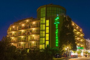 A multi-story hotel with a prominent green sign reading 'HOTEL BOOMERANG.' - Hotel Dalis (Nessebar)