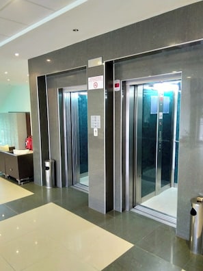 An elevator area with metallic doors and a no-smoking sign. - Hotel Dalis (Nessebar)