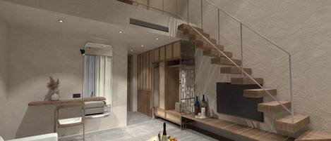 A modern interior with a staircase, seating area, and a dining table with a fruit tray.