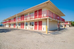 A two-story motel with a red and white color scheme, featuring a central entrance and multiple windows on each floor. - Days Inn by Wyndham Wichita Falls (Wichita Falls)