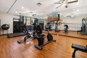 A gym with treadmills, elliptical machines, and weight equipment. - Beachfront Palms Resort Galveston, an Ascend Collection Hotel (Galveston)