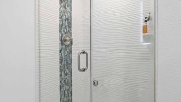 Shower, hair dryer, towels, shampoo