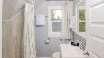 Shower, hair dryer, towels, shampoo
