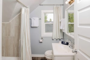 Shower, hair dryer, towels, shampoo