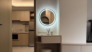 A modern bathroom with a vanity, mirror, and toilet. - The best vacation at Kamala Beach! Pool, gym, shuttle bus .511 (Tambon Kamala)