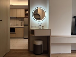 A modern bathroom with a vanity, mirror, and toilet. - The best vacation at Kamala Beach! Pool, gym, shuttle bus .511 (Tambon Kamala)