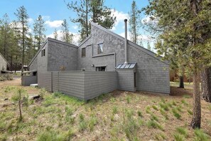 A modern house with a sloped roof, a chimney, and a small window. - Location! SHARC is a skip away! (Sunriver)