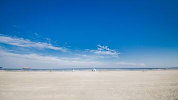 On the beach, sun loungers, beach towels