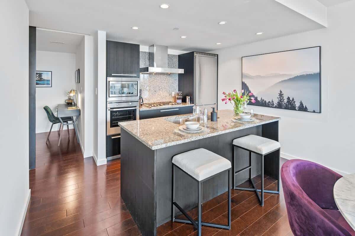 Unleash your inner chef in this fully equipped chef's kitchen, featuring gorgeous granite countertops and high-end stainless steel appliances.