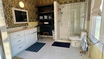 Shower, towels, soap, toilet paper
