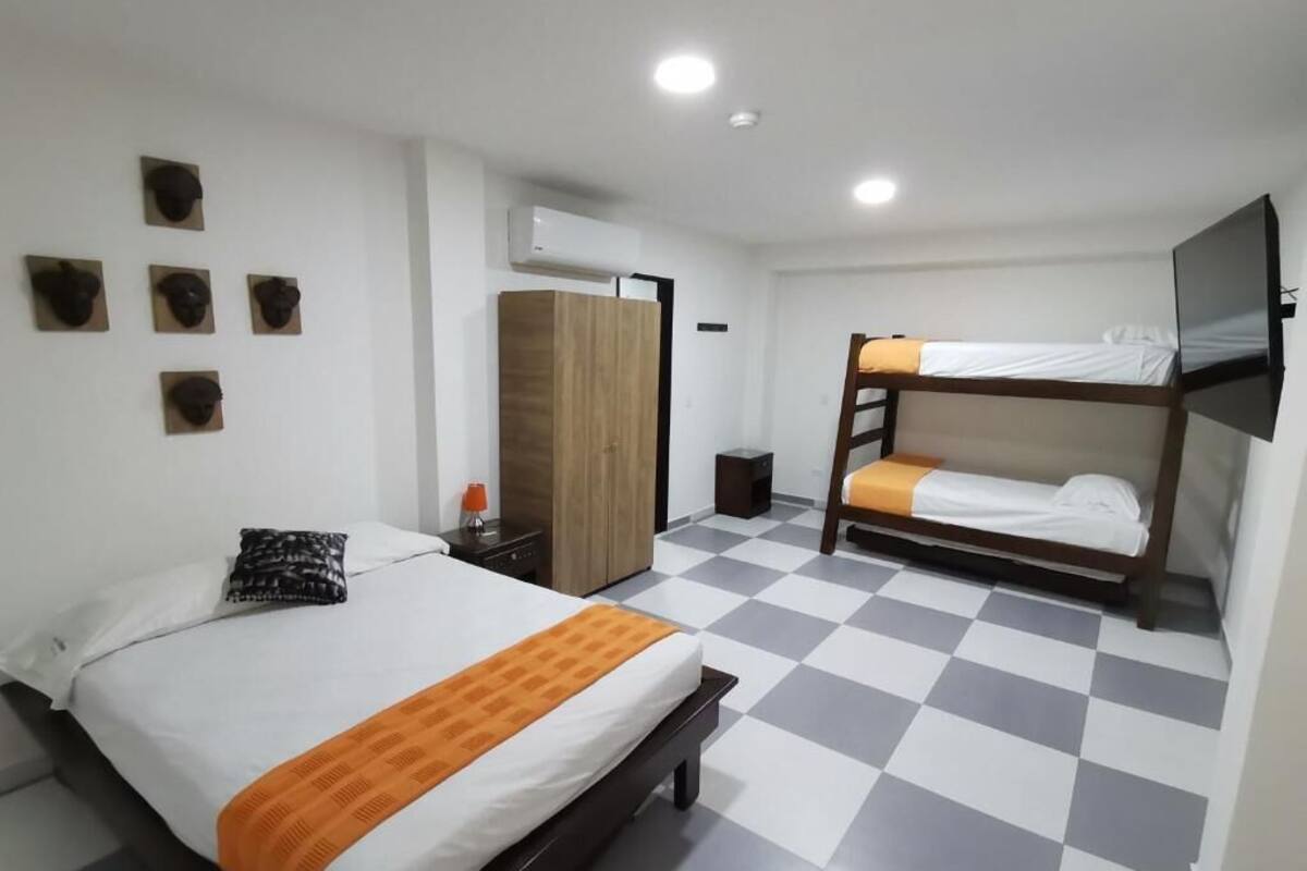 Deluxe Quadruple Room, Patio | In-room safe, soundproofing, iron/ironing board, free WiFi