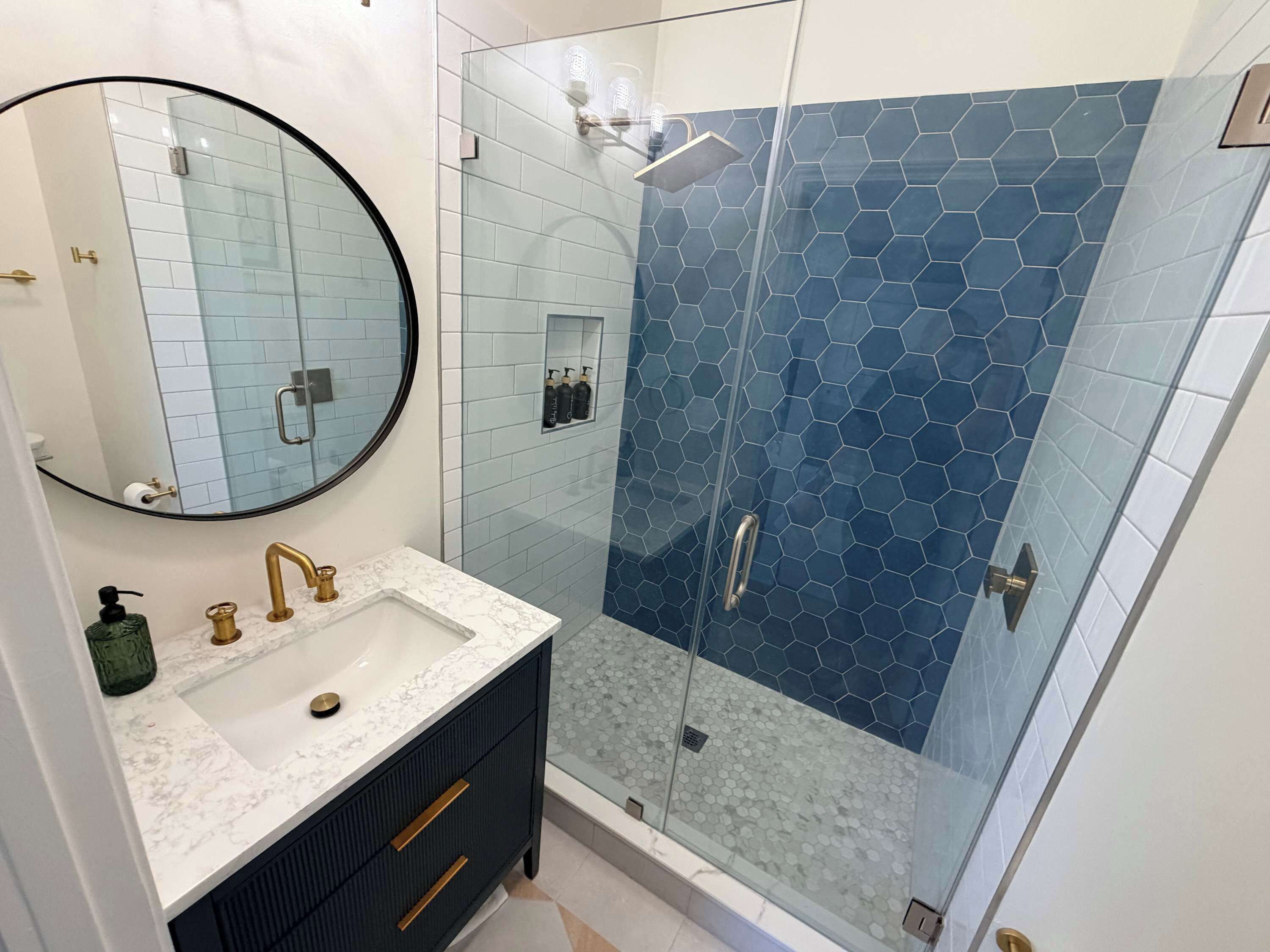 Shower, hair dryer, towels, shampoo