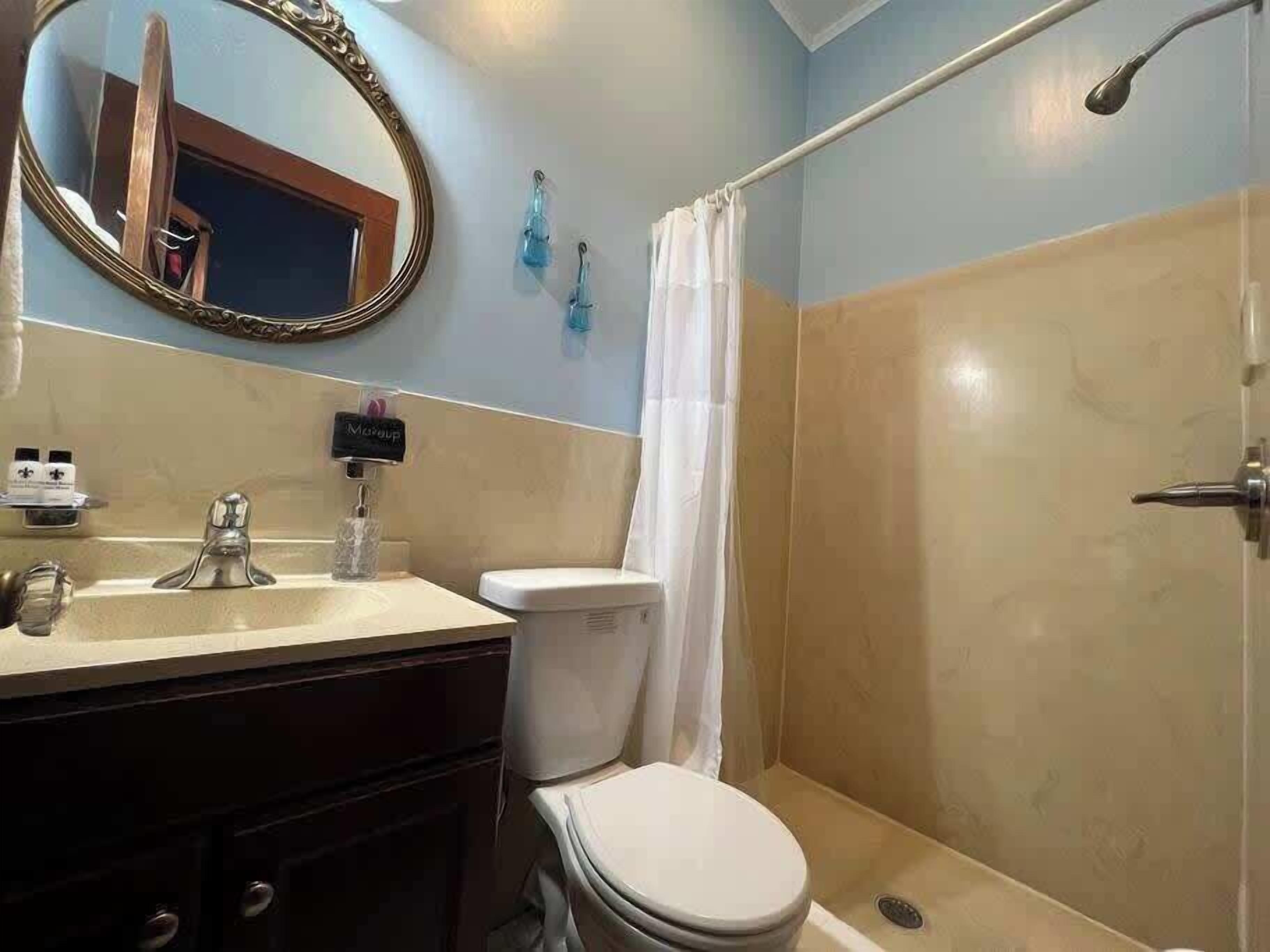 Shower, hair dryer, towels, shampoo