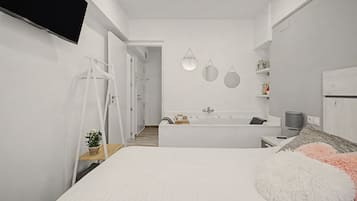A modern bathroom with a bathtub, a shower, and a toilet. There are two mirrors on the wall, and a towel rack is visible.
