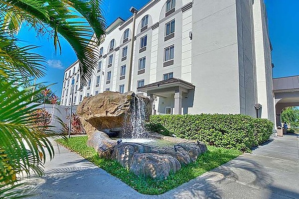 Start your stay beside lush landscaping and a calming waterfall.