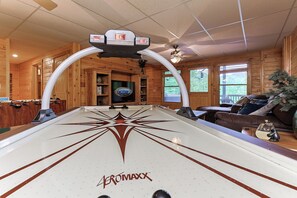 A pool table with a star design and the brand name 'Bromaxx' in the center.
