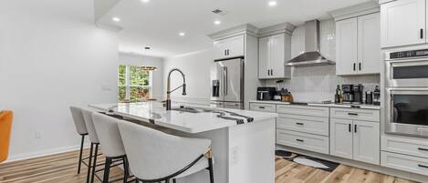 Coffee/tea maker, fridge, microwave, oven