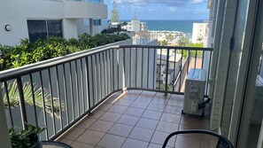 A balcony with a view of the ocean, a tiled floor, and a metal railing. - Canberra Heights Unit 5, 35 Canberra Terrace, King (Kings Beach)
