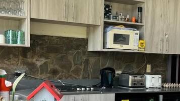 Fridge, microwave, cookware/dishes/utensils