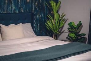 A bed with white linens, a blue headboard, and a green throw blanket. - 4-bdrm, Sauna, Gym and Private Pool, Perfectly located!  - Casa Azul Retreat (Mesa)