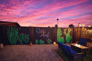 An outdoor patio area with a wall mural featuring cacti and the text 'Casa Aida.' - 4-bdrm, Sauna, Gym and Private Pool, Perfectly located!  - Casa Azul Retreat (Mesa)