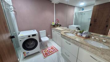 Shower, hair dryer, towels, soap