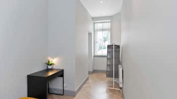 1 bedroom, desk, iron/ironing board, travel crib