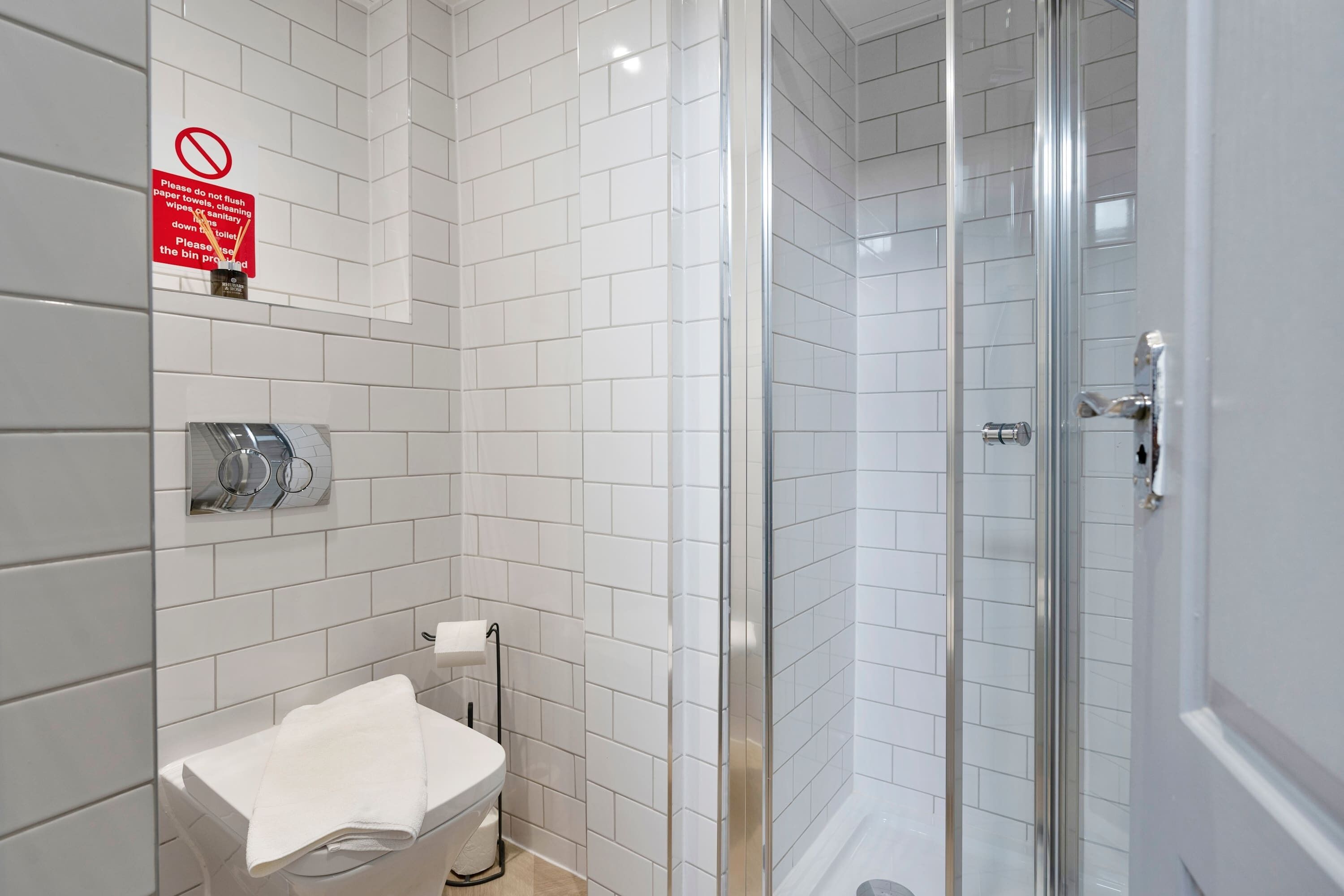 Shower, hair dryer, towels, shampoo