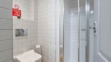 Shower, hair dryer, towels, shampoo