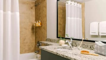 Combined shower/bathtub, towels, soap, shampoo