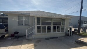 A single-story house with a garage, a small porch, and a clear sky. - Studio efficiency in the heart of downtown Saint Augustine (St. Augustine)