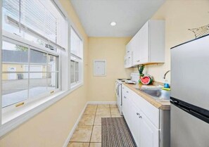 Family Quadruple Room, Patio, Pool View | Private kitchen